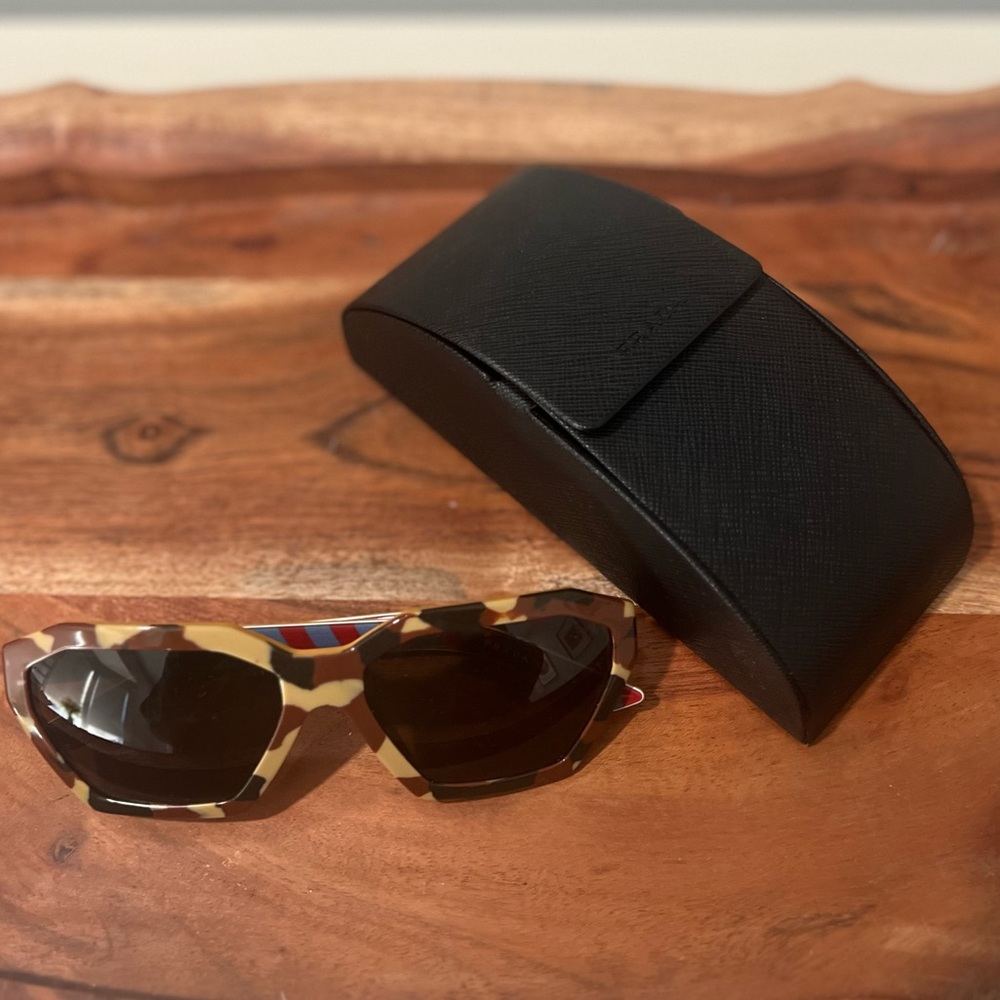 Authentic Prada sunglasses with original Prada hard case.  Very gently used.